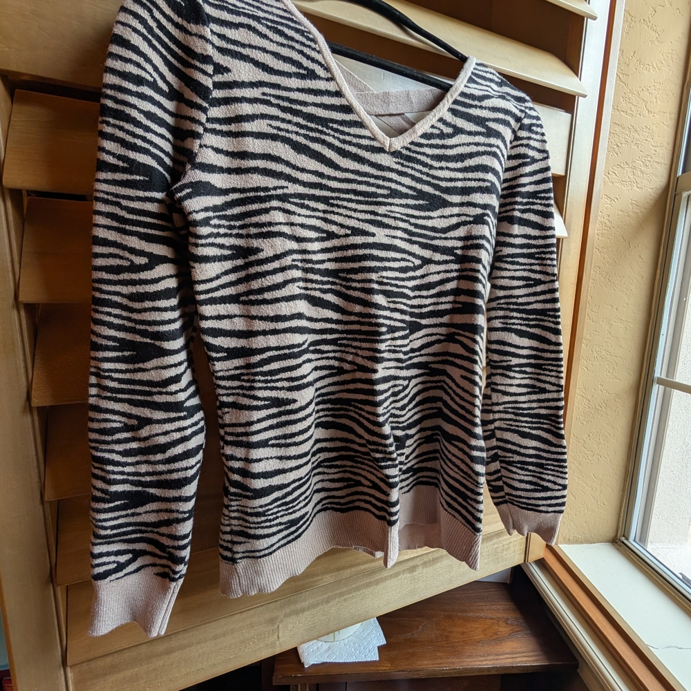 Black and Cream V-Neck Sweater with Bold Animal Print